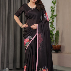 Black Satin Georgette Floral Printed Saree with Soft Pink Border & Attached Blouse – Elegant Designer Partywear Drape