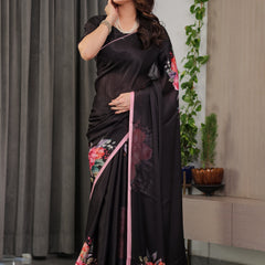 Black Satin Georgette Floral Printed Saree with Soft Pink Border & Attached Blouse – Elegant Designer Partywear Drape