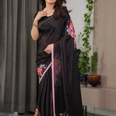 Black Satin Georgette Floral Printed Saree with Soft Pink Border & Attached Blouse – Elegant Designer Partywear Drape
