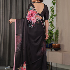 Black Satin Georgette Floral Printed Saree with Soft Pink Border & Attached Blouse – Elegant Designer Partywear Drape